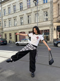 DAXUEN Distressed graphic crewneck T-shirt in white and grey melange — model photo