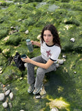 DAXUEN Distressed graphic crewneck T-shirt in white and grey melange — model photo