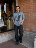 DAXUEN washed blue oversized distressed face graphic t-shirt — model photo