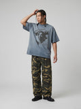 DAXUEN washed blue oversized distressed face graphic t-shirt — model photo