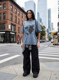 DAXUEN washed blue oversized distressed face graphic t-shirt — model photo