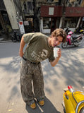 DAXUEN distressed graphic head t-shirt — model photo