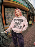 DAXUEN light pink oversized distressed graphic hooded sweatshirt — model photo