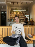 DAXUEN Distressed graphic long sleeve t-shirt — model photo