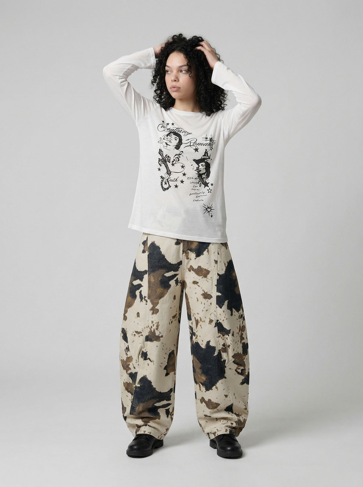 DAXUEN Distressed graphic long sleeve t-shirt — model photo