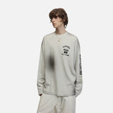 DAXUEN Distressed graphic long sleeve crew neck top — model photo