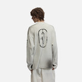 DAXUEN Distressed graphic long sleeve crew neck top — model photo