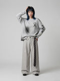 DAXUEN Distressed graphic long sleeve crew neck top — model photo