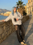 DAXUEN Distressed graphic long sleeve crew neck top