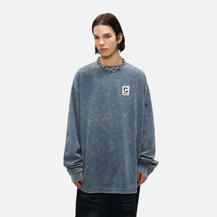 DAXUEN Distressed oversized long sleeve top — model photo