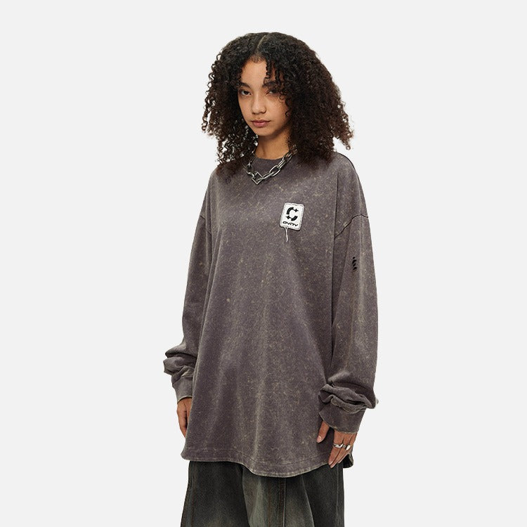 DAXUEN Distressed oversized long sleeve top — model photo
