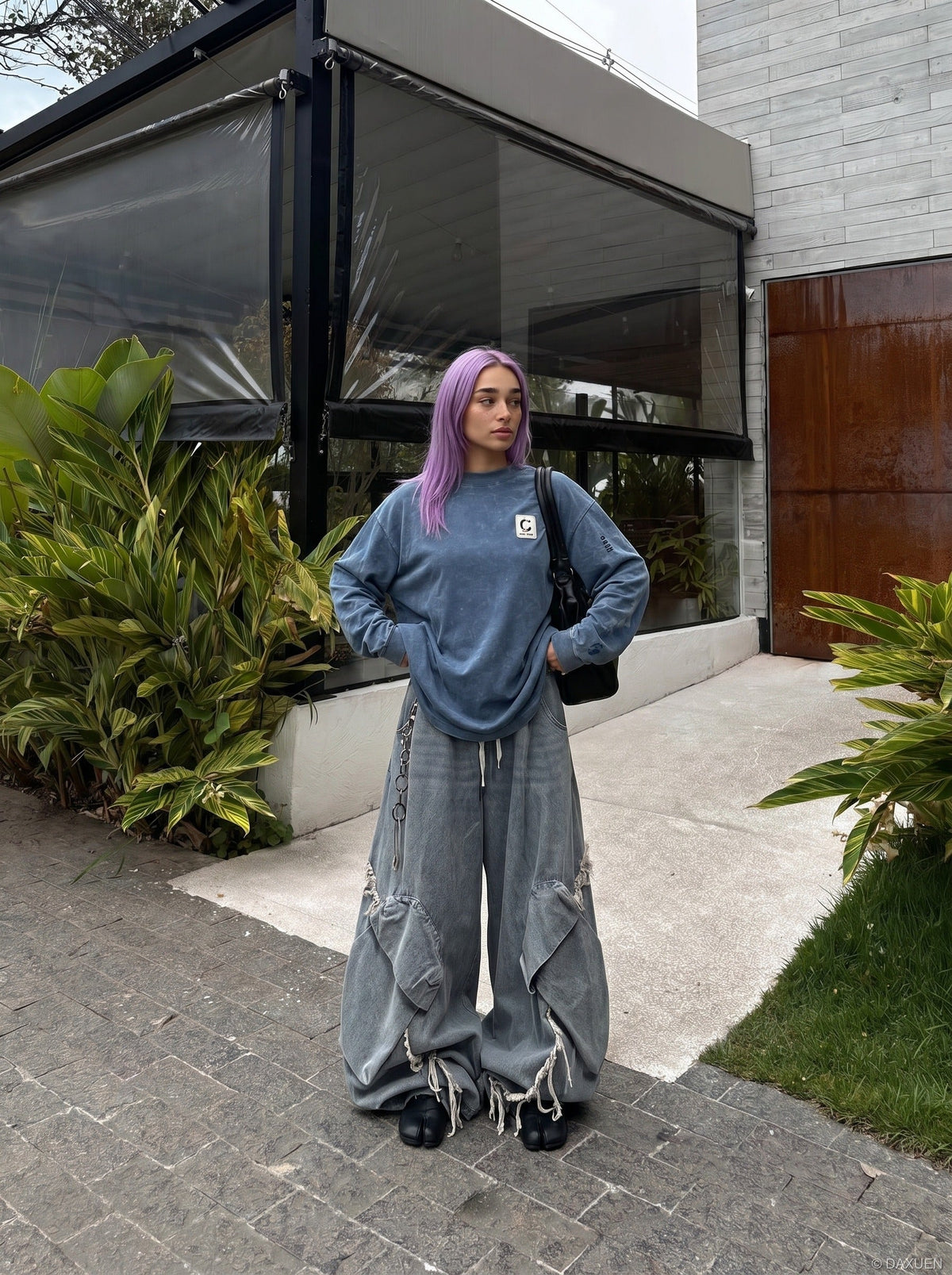 DAXUEN Distressed oversized long sleeve top — model photo