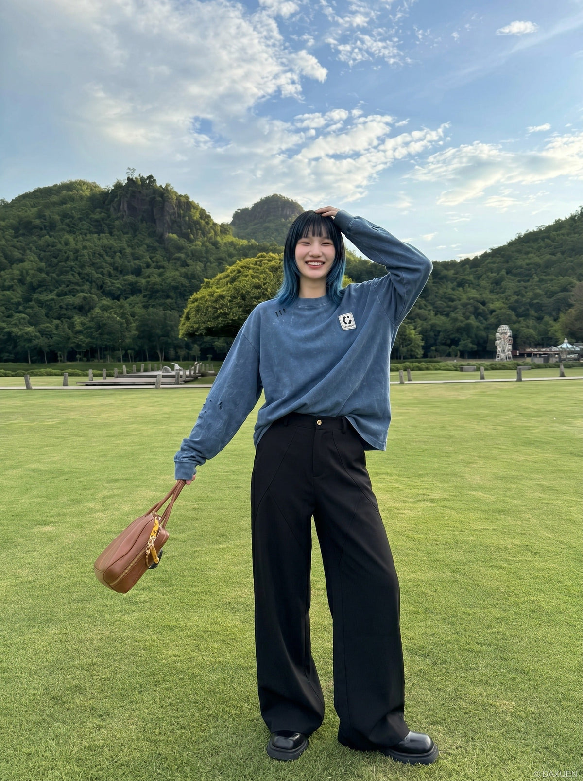 DAXUEN Distressed oversized long sleeve top — model photo