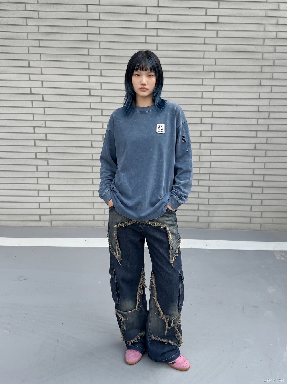 DAXUEN Distressed oversized long sleeve top — model photo