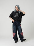DAXUEN Distressed graphic oversized short-sleeved shirt — model photo