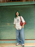 DAXUEN Distressed graphic oversized short-sleeved shirt — model photo