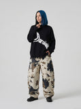 DAXUEN Distressed graphic oversized knitted sweater — model photo