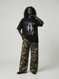 DAXUEN black oversized distressed graphic person t-shirt — model photo