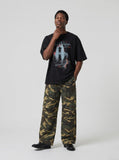 DAXUEN black oversized distressed graphic person t-shirt — model photo