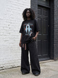 DAXUEN black oversized distressed graphic person t-shirt — model photo