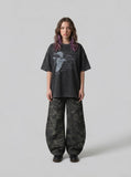 DAXUEN dark grey oversized distressed graphic person tee — model photo