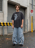 DAXUEN dark grey oversized distressed graphic person tee — model photo