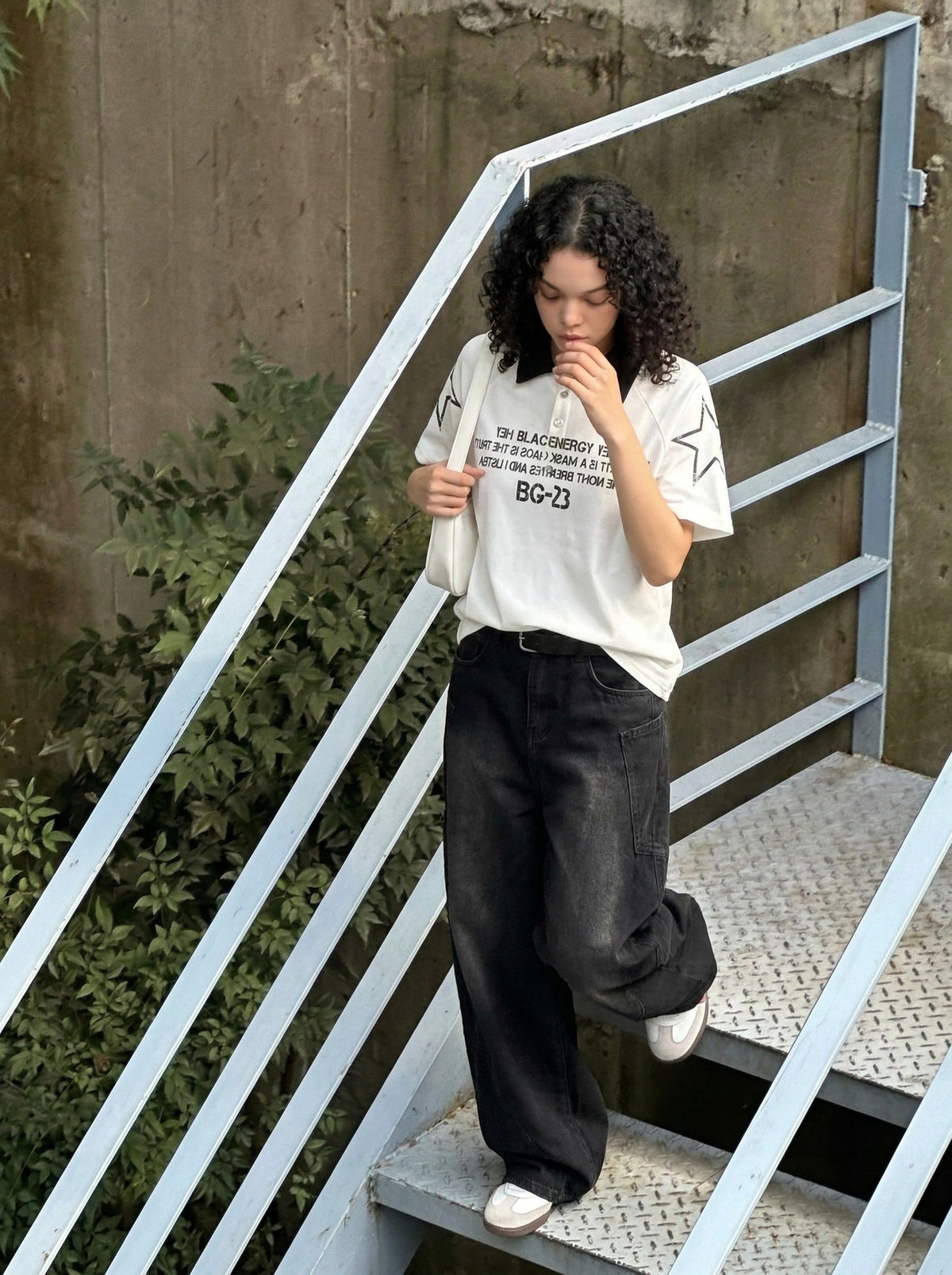 DAXUEN Distressed graphic polo shirt with unique designs — model photo