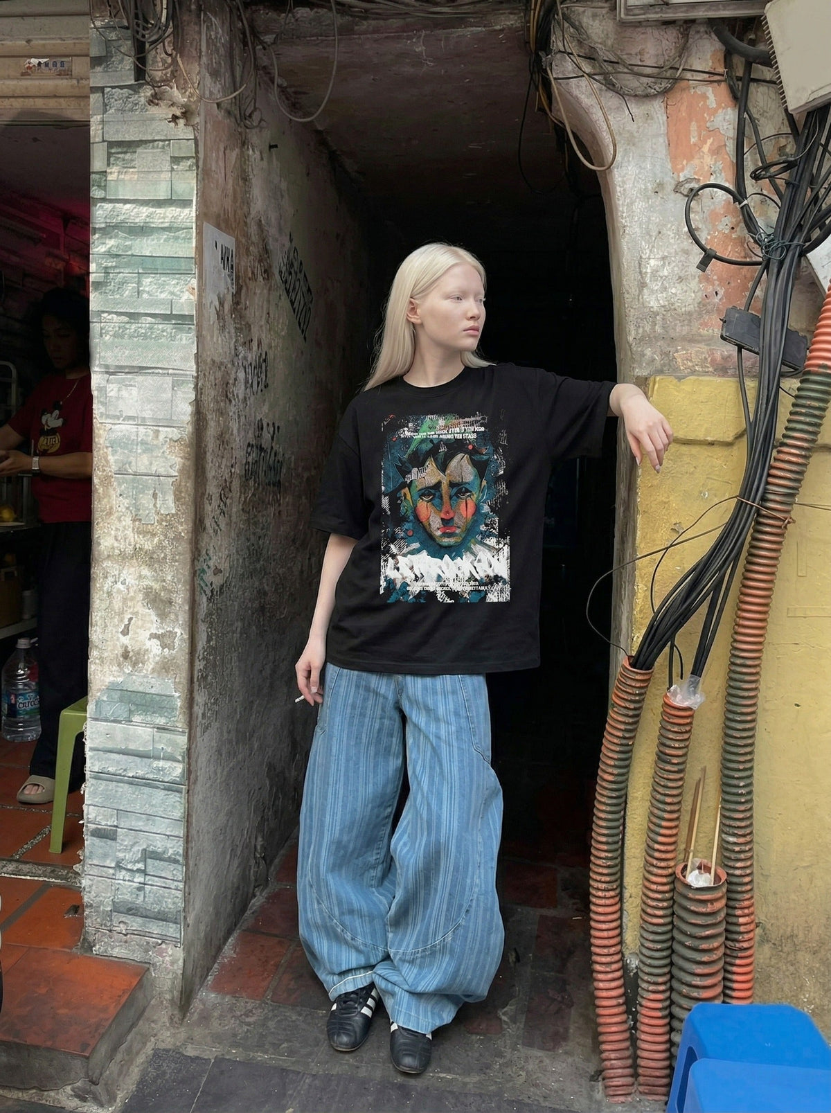 DAXUEN Distressed graphic portrait t-shirt in black and white — model photo