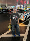 DAXUEN Distressed graphic print loose-fit T-shirt — model photo
