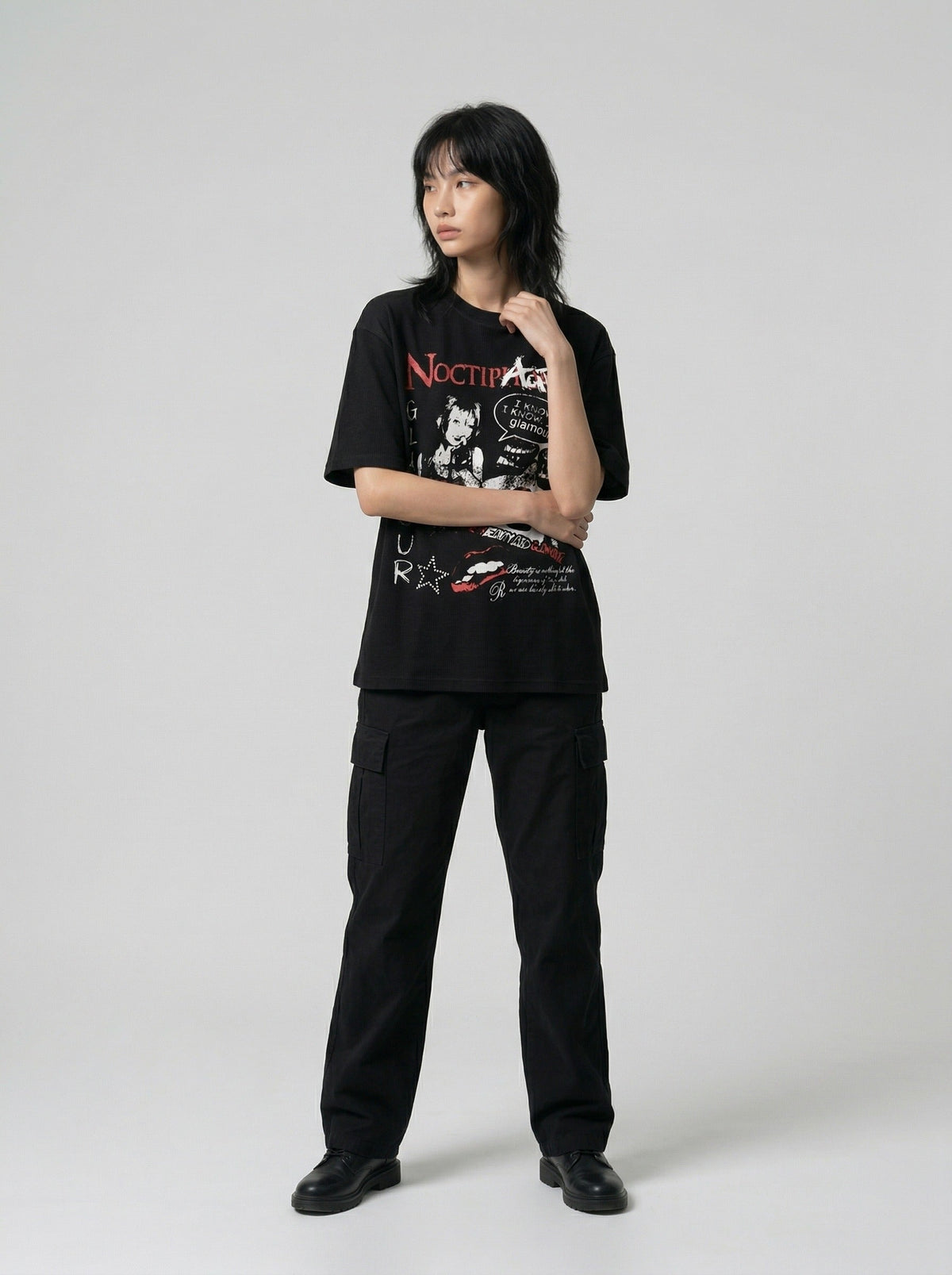 DAXUEN Black short-sleeved t-shirt with distressed graphic design — model photo