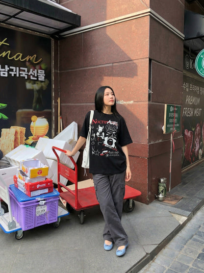 DAXUEN Black short-sleeved t-shirt with distressed graphic design — model photo