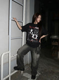 DAXUEN Black short-sleeved t-shirt with distressed graphic design — model photo