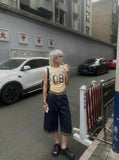 DAXUEN Distressed graphic ruched short-sleeved t-shirt — model photo
