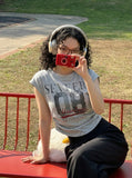 DAXUEN Distressed graphic ruched short-sleeved t-shirt — model photo