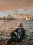 DAXUEN Distressed graphic T-shirt with raw-cut edges — model photo