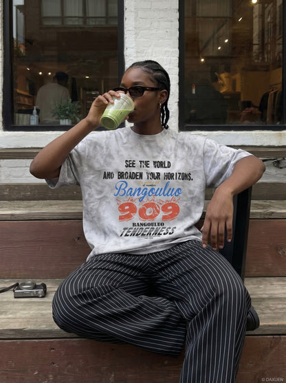 DAXUEN Oversized distressed graphic tie-dye short-sleeve T-shirt — model photo