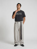 DAXUEN faded black distressed text graphic t-shirt — model photo