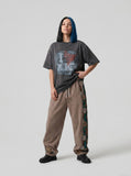 DAXUEN charcoal grey oversized distressed heart graphic tee — model photo