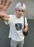 DAXUEN Distressed oversized T-shirt with heart graphic — model photo