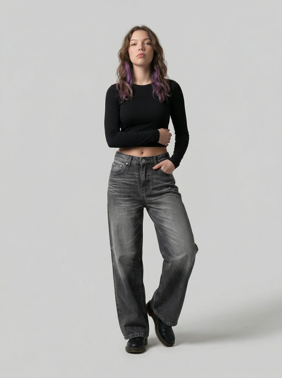 DAXUEN Distressed high-waisted wide-leg jeans in washed black denim — model photo