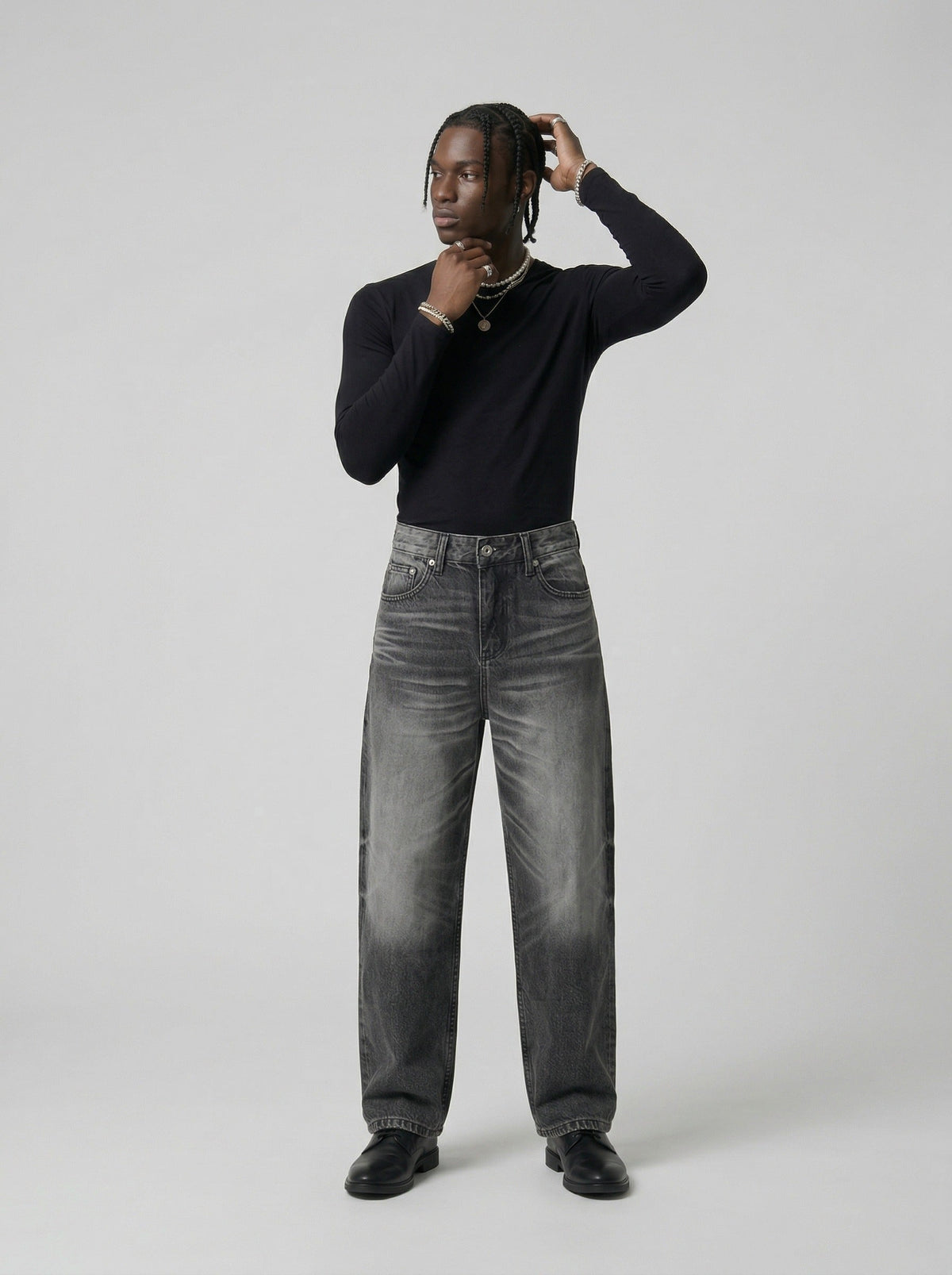 DAXUEN Distressed high-waisted wide-leg jeans in washed black denim — model photo