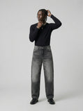 DAXUEN Distressed high-waisted wide-leg jeans in washed black denim — model photo