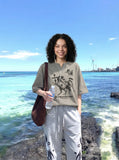 DAXUEN Oversized short-sleeve T-shirt with horse graphic — model photo