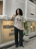 DAXUEN Oversized short-sleeve T-shirt with horse graphic — model photo