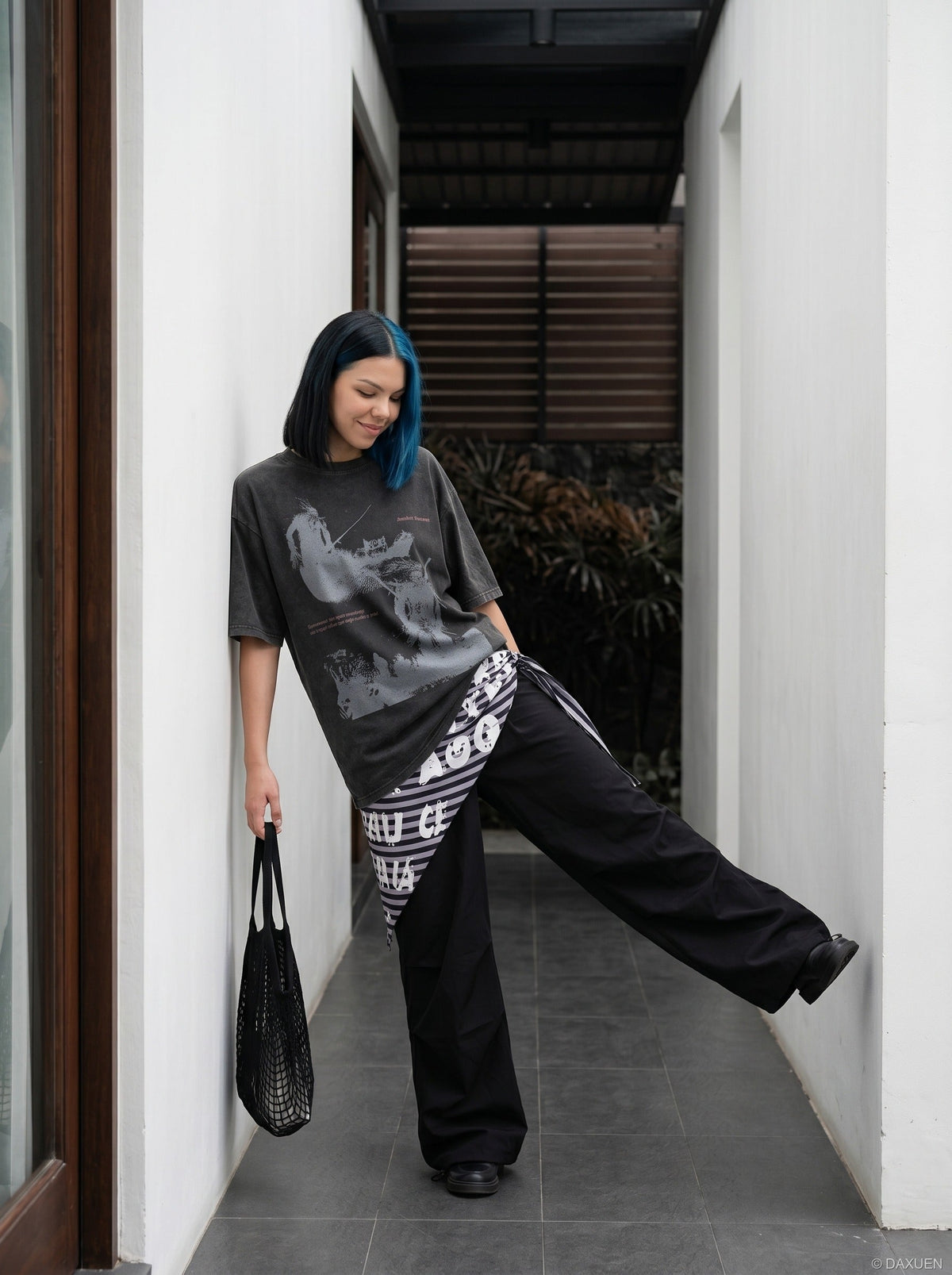 DAXUEN distressed illustrative graphic tee — model photo