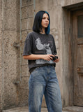 DAXUEN distressed illustrative graphic tee — model photo