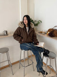 DAXUEN Distressed indigo relaxed-fit straight-leg jeans — model photo