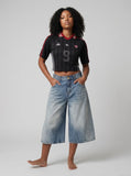 DAXUEN black wide-leg trousers with vertical pinstripes — model photo