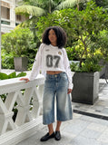 DAXUEN black wide-leg trousers with vertical pinstripes — model photo