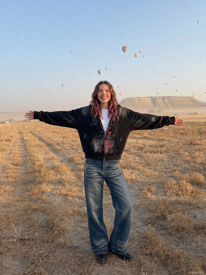 DAXUEN medium wash distressed wide-leg jeans with studs — model photo